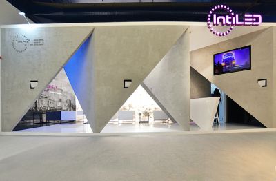 IntiLED на выставке Light and Building 2014 
Более 1000 гостей стенда IntiLED из 50 стран мира оценили не только безупречное качество продукции компании, дополняемое впечатляющим портфолио объектов Олимпиады Сочи-2014, но и незаурядный дизайн стенда, спроектированный европейскими специалистами. Идея пространства, изменяемого под влиянием светового потока, как нельзя лучше подчеркнула роль грамотного освещения в формировании и восприятии архитектурной среды. Стены, имитирующие бетонную поверхность, поражали наблюдателей своей реалистичностью, вынуждая потрогать фактуру и непременно зайти внутрь. Пройдя бетонный лабиринт стен, посетитель оказывался в легком и функциональном интерьере, в который органично вписывались светодиодные прожекторы IntiLED. 
Keywords: Светодиодное освещение, архитектурная подсветка, архитектурное освещение, Light and Building 2014, светодиодное оборудование 